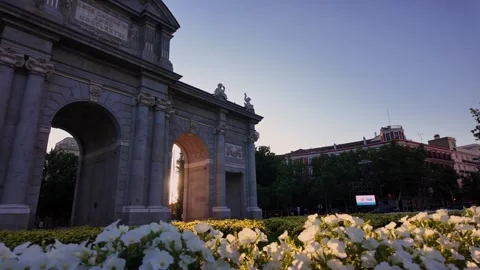 Sunset Handheld View of Puerta de Alcala and Blossoms in Madrid, Spain Stock Footage 341938999