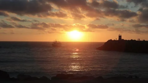Sunset at the harbor entrance Stock Footage 296687789