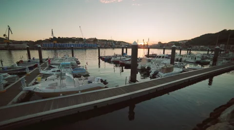 Sunset at harbour with boats Stockbeeldmateriaal 56156915