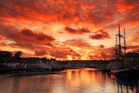 Sunset at the harbour Stock Photos