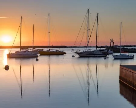 Sunset at the harbour Stock Photos