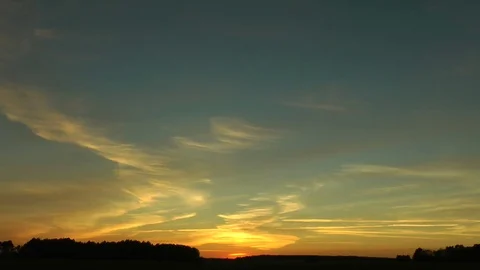 The sunset has painted rare clouds in red, orange and yellow color. Видео 70471620