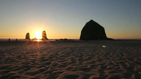 Sunset with Haystack Rocks in Cannon Beach Oregon 1080p at Lowtide Panning Stock Footage 12109685