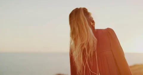 Sunset is her favorite time of the day Stock Footage 121870796