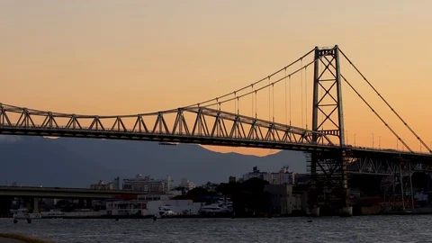 Sunset on the Hercílio Luz bridge, in Florianópolis, Santa Catarina, Brazil Stock Footage 129325341