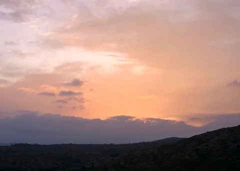 Sunset in the high mountains with clouds Stock Photos