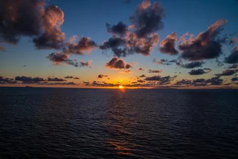 Sunset on the high seas. Stockfoto's