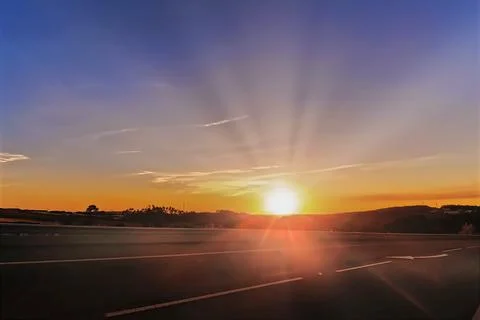 Sunset on the highway in the evening. Stock Photos
