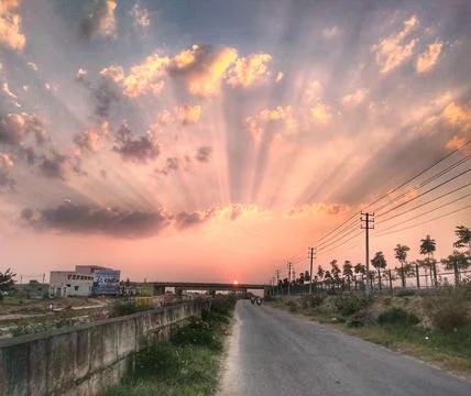 Sunset on the highway road Stock Photos