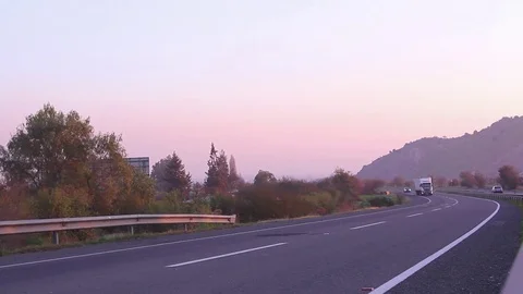 Sunset highway with vehicles Stock Footage 77050535