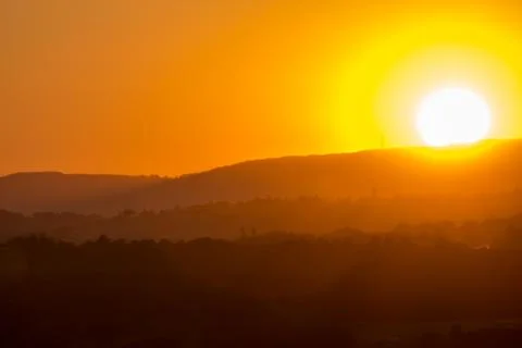 Sunset in the hills Stock Photos
