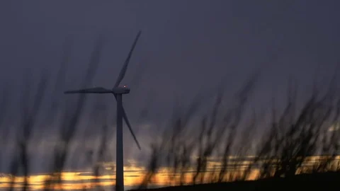 Sunset with Hillside Wind Turbine Stock Footage 72701836
