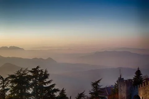 Sunset on hilltops in the mist Stock Photos