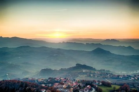 Sunset on hilltops in the mist Stock Photos