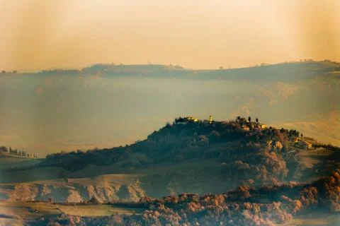 Sunset on hilly countryside in winter Stock Photos