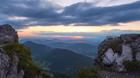 Sunset in a hilly summer landscape, rocks and rhombus illuminated by the setting Stock-Footage 265658236