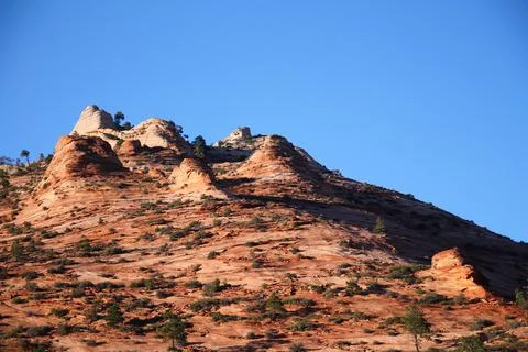 The sunset hitting the typical red rock of Zion National Park Stock Photos