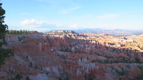 Sunset hoodoos rock formations in Bryce Canyon Utah with zooming in amphitheater Stock Footage 136869112