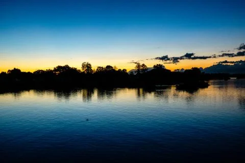 Sunset at the horizon Si Phan Don, Laos Stock Photos