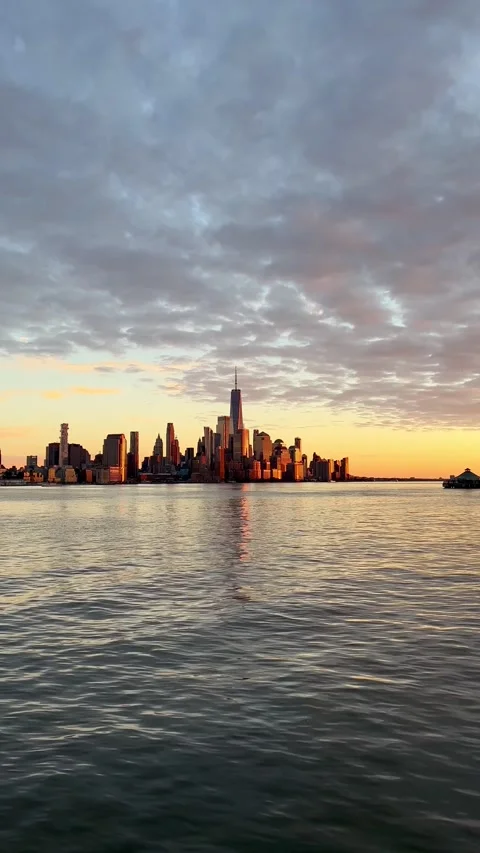 Sunset hour view of Financial District from Hoboken, NJ Stock Footage 311673419