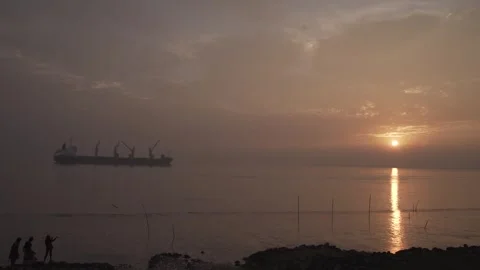 At sunset, a huge cargo ship passed over the river. Stock Footage 248636230