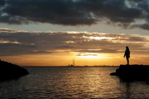 Sunset with human silhouette Stock Photos