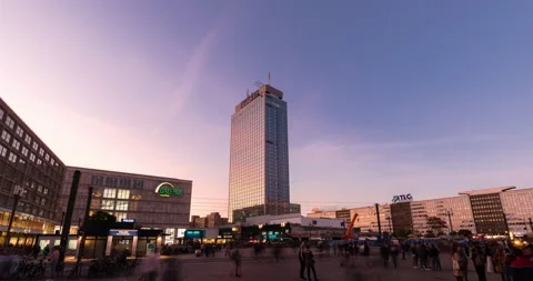 Sunset hyper lapse at Berlin Alexanderplatz, crowded with people moving Stock Footage 143414812