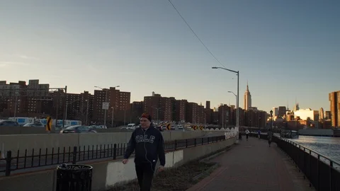 Sunset Hyperlapse on the East River bike path with view of Empire State Building Stock Footage 109426466