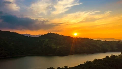 Sunset hyperlapse over a lake and mountains Stock Footage 130426744