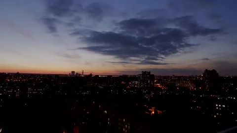 Sunset Hyperlapse. The sun slowly descends behind the buildings of the city Stock Footage 221482203