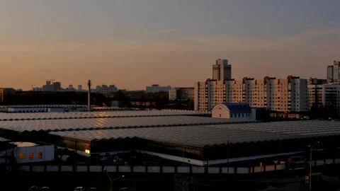 Sunset Hyperlapse. The sun slowly descends behind the buildings of the city Stock Footage 221482242