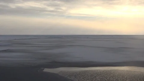 Sunset on the ice floe seen from a sailing boat, North Pole Video stock 104875038