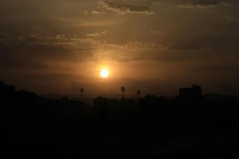 Sunset illuminates clouds over Sana'a, Sanaa, Yemen - 13 Jun 2026 Fotos Stock