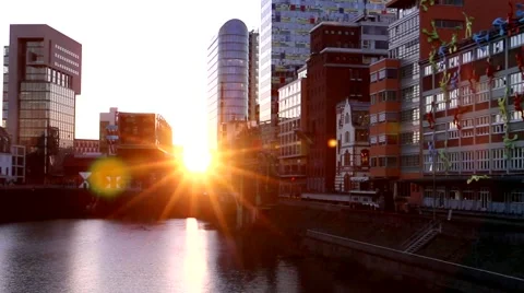 Sunset illuminates the modern building on the waterfront in Düsseldorf Stock Footage 63269010