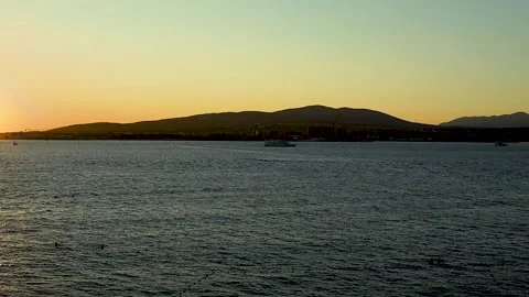 Sunset illuminates the ocean surface with reflections Stock Footage 344813355