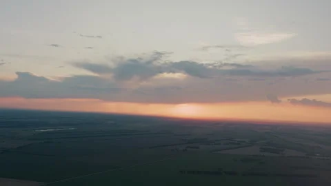 Sunset illuminating patchwork farmland and distant treelines Stock Footage 317161307