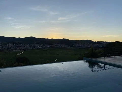 Sunset in an infinity poo Stock Photos