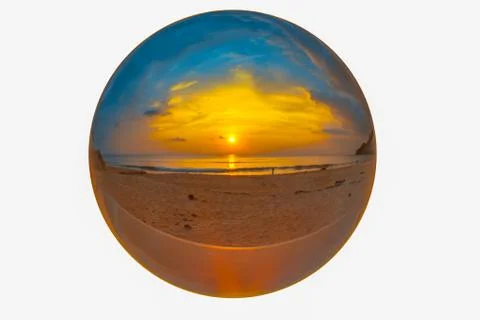 Sunset inside the crystal ball on the beach Stock Photos