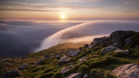 Sunset with inversion flowing over the coastline Stock Footage 122958601