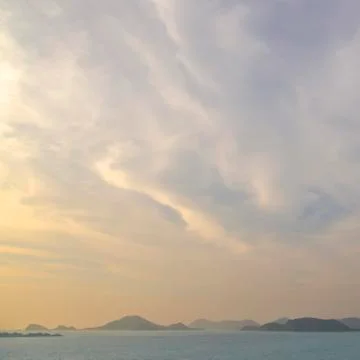 Sunset with the island Stock Photos