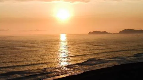 Sunset with island Stock Photos