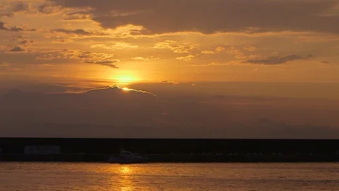 Sunset at an italian beach pointing the sky with orange light Video stock 88713451