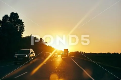 Sunset in a journey on the road Stock Photos