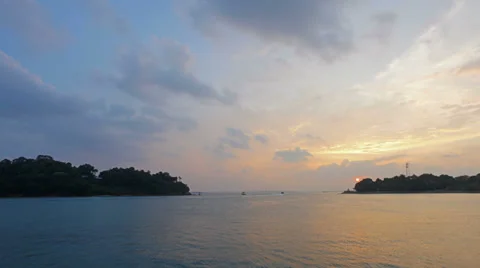 Sunset at Keppel Bay Waterfront with Moving Clouds and Blue Sky Time Lapse Stock Footage 36248907