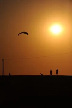Sunset kite surfing Stock Photos