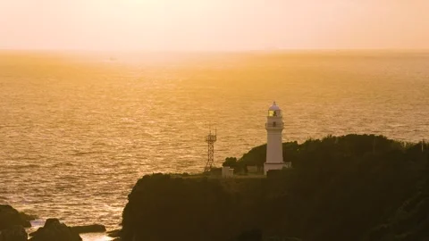 Sunset at Kushimoto Coast, Lighthouse over Ocean, Southernmost Point of Honshu Stock Footage 345218795