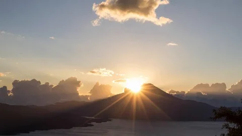 Sunset at lake atitlan, view on volcano San Pedro, orange clouds timelapse Stock Footage 114709545