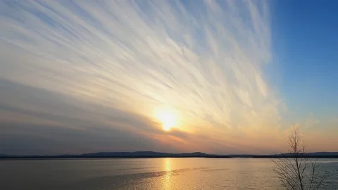 Sunset on the lake. Beautiful clouds and sun. Time lapse 4k. Stock Footage 239604371