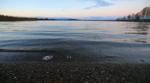 Sunset on the lake. camera movement. Stockbeeldmateriaal 12462156