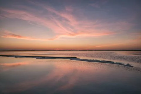 Sunset lake clouds reflection horizon Stock Photos